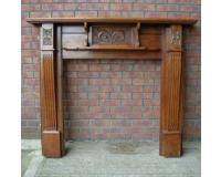 Victorian Arts and Crafts carved walnut fire surround